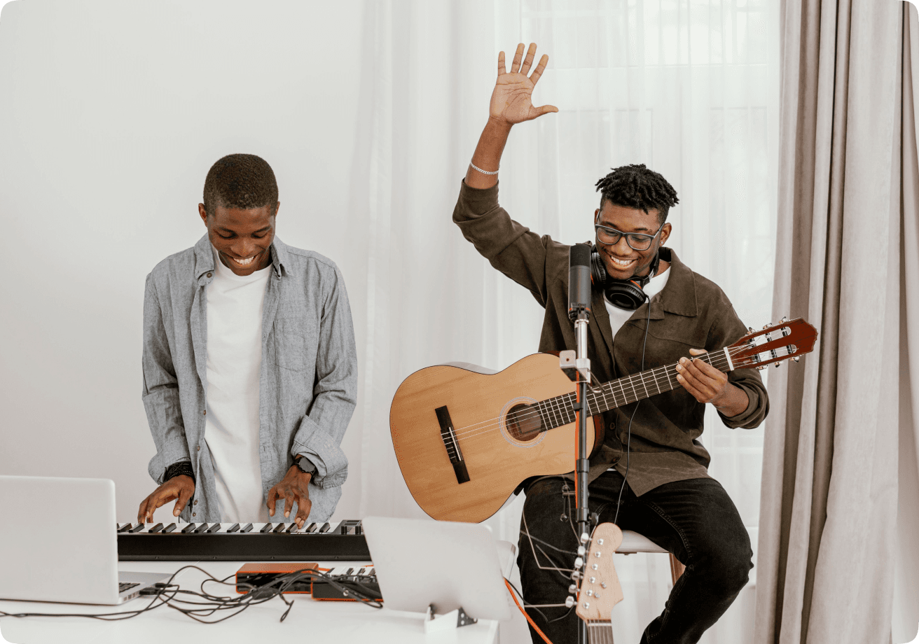 Two musicians collaborating with keyboard and guitar